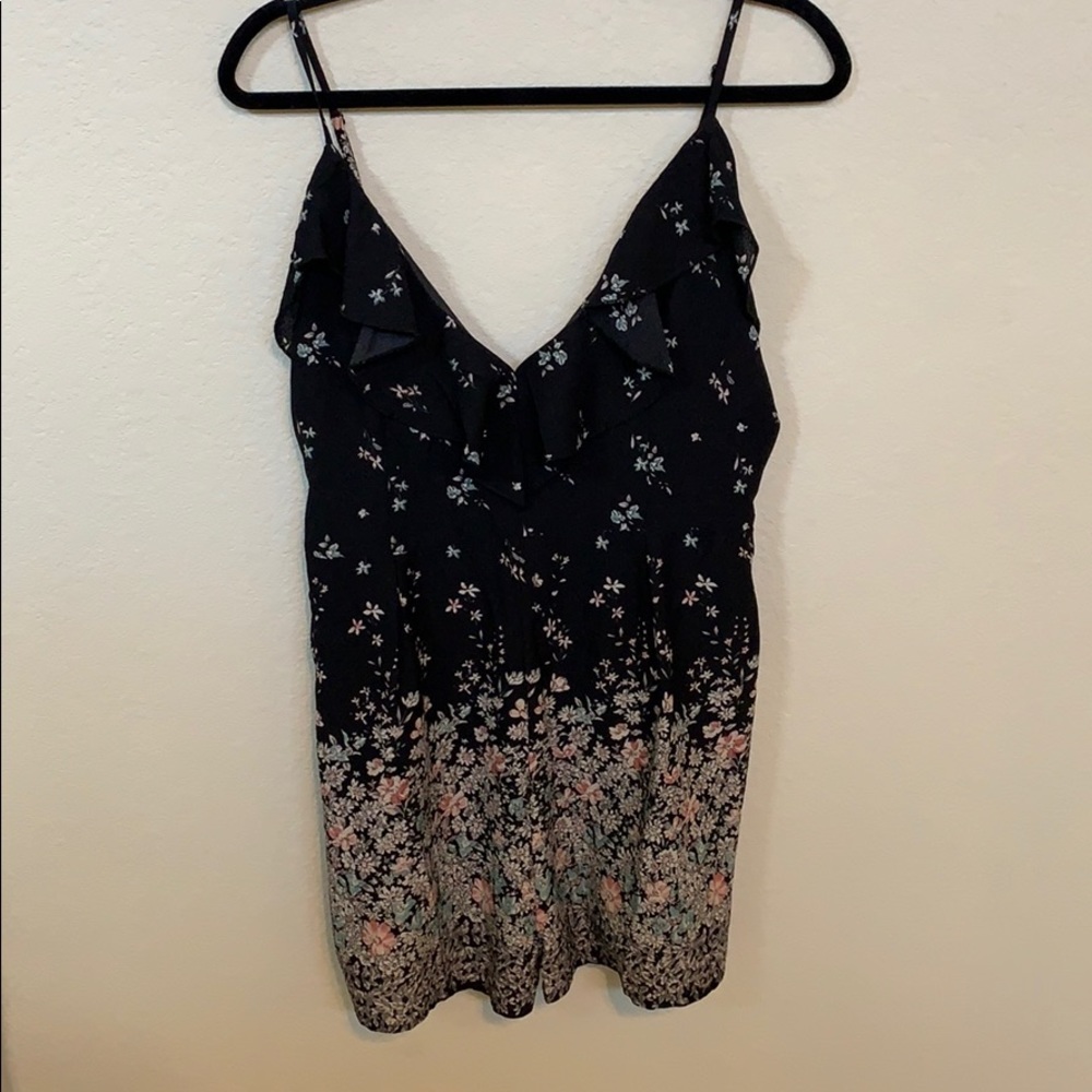 Black ruffled floral romper